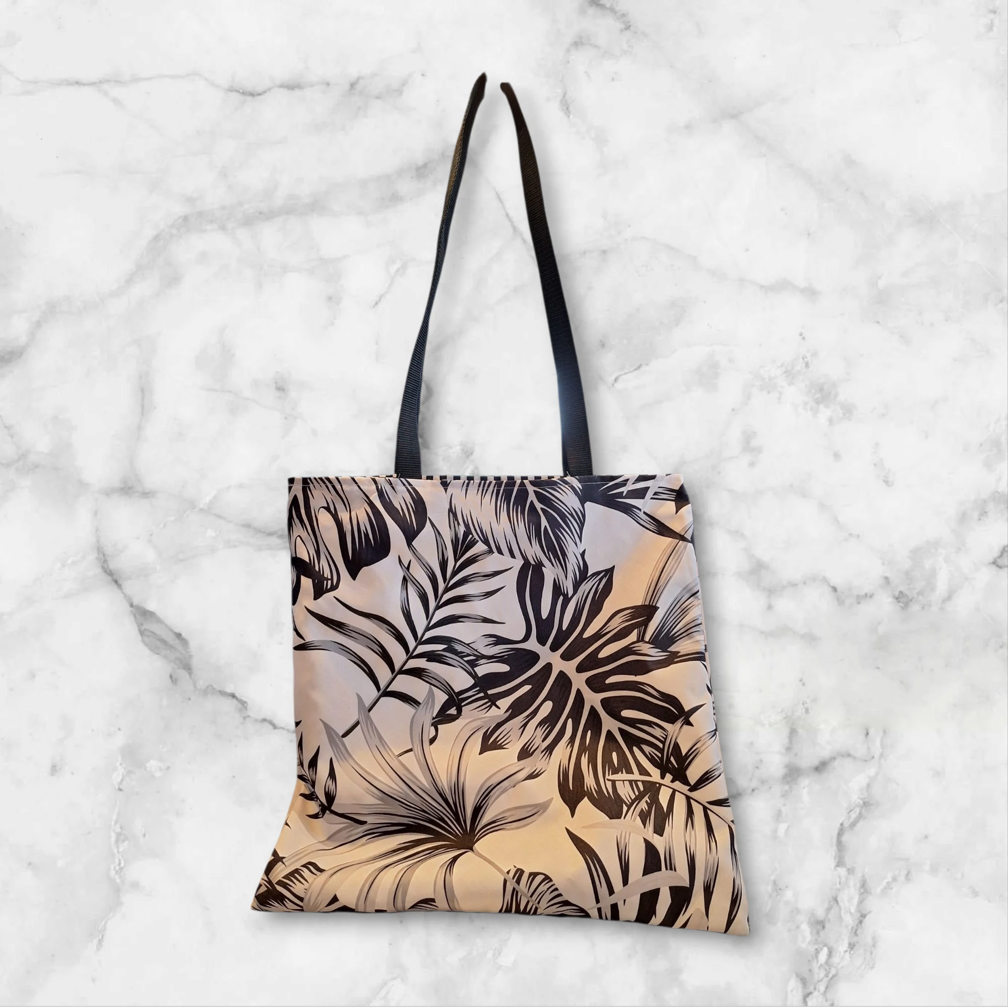 tote bag imperméable réversible feuillage noir tropical / losanges